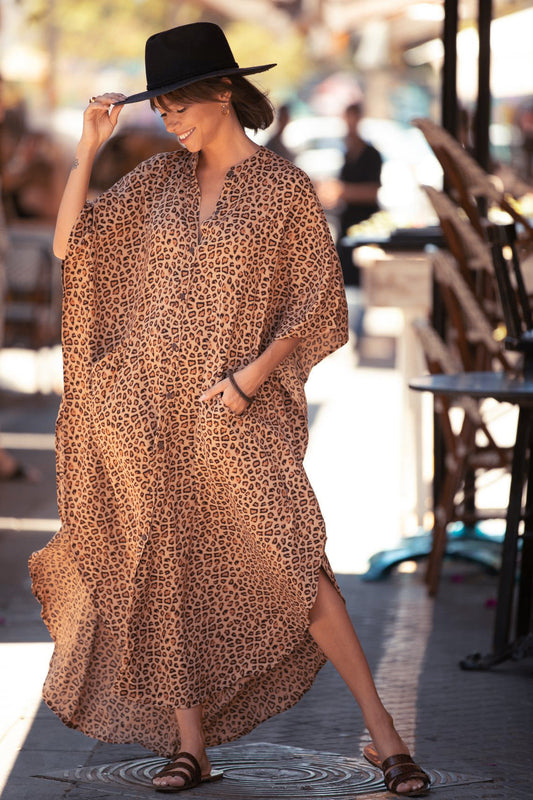 Leopard print kaftan with buttons and pockets and side slits
