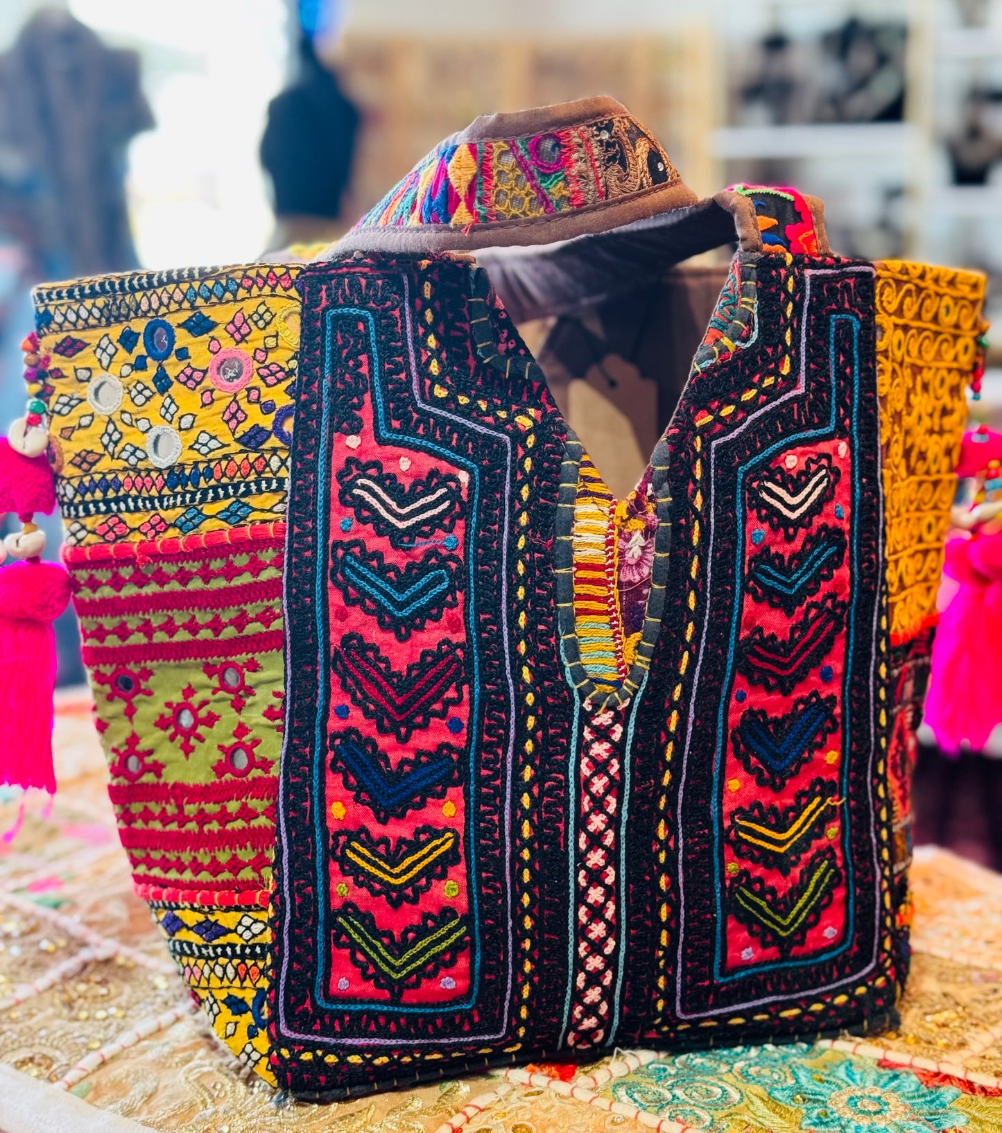 Back side Black Banjara with hand embrioidered patches in salmon, and yellow colors