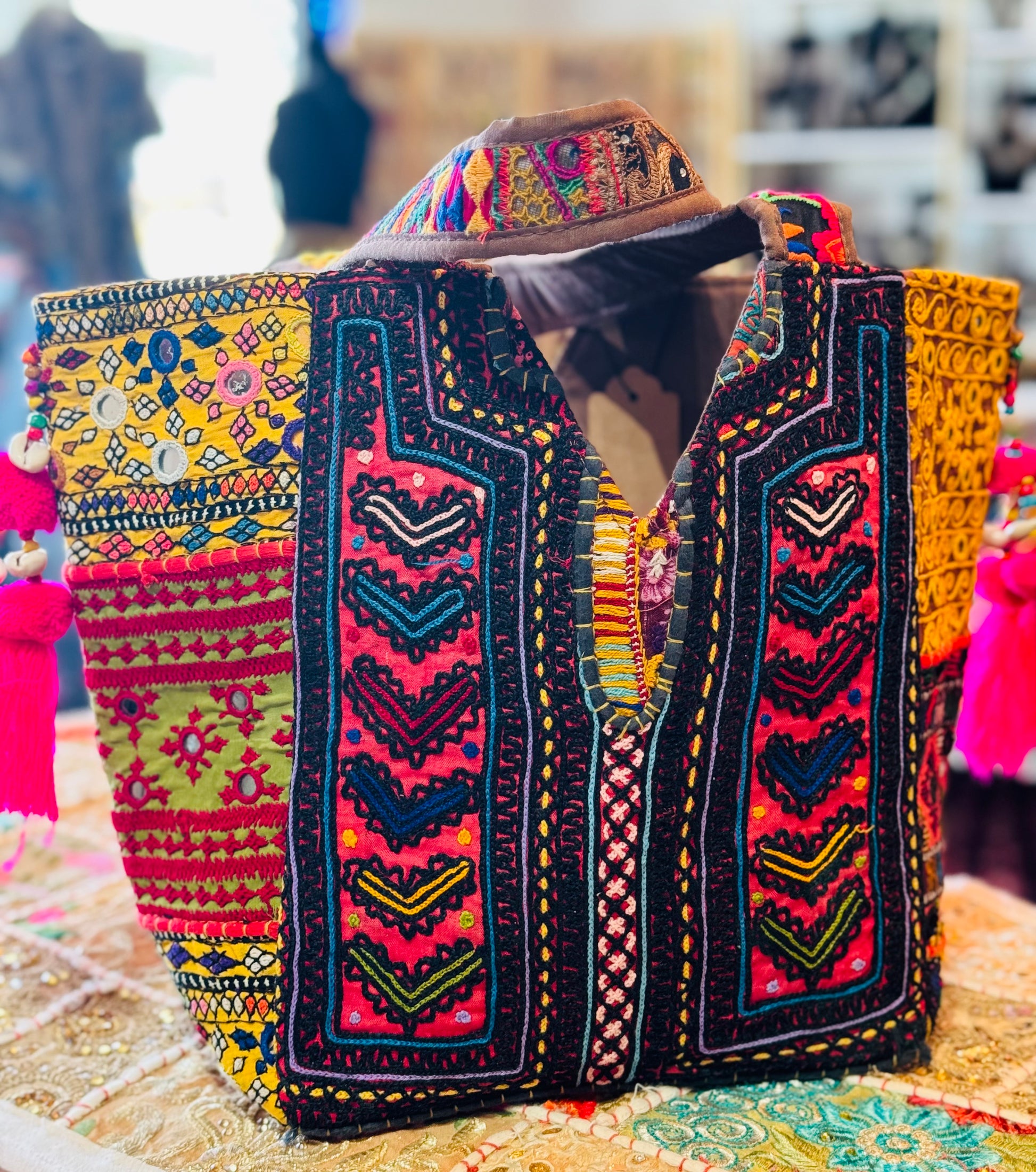Back side Black Banjara with hand embrioidered patches in salmon, and yellow colors
