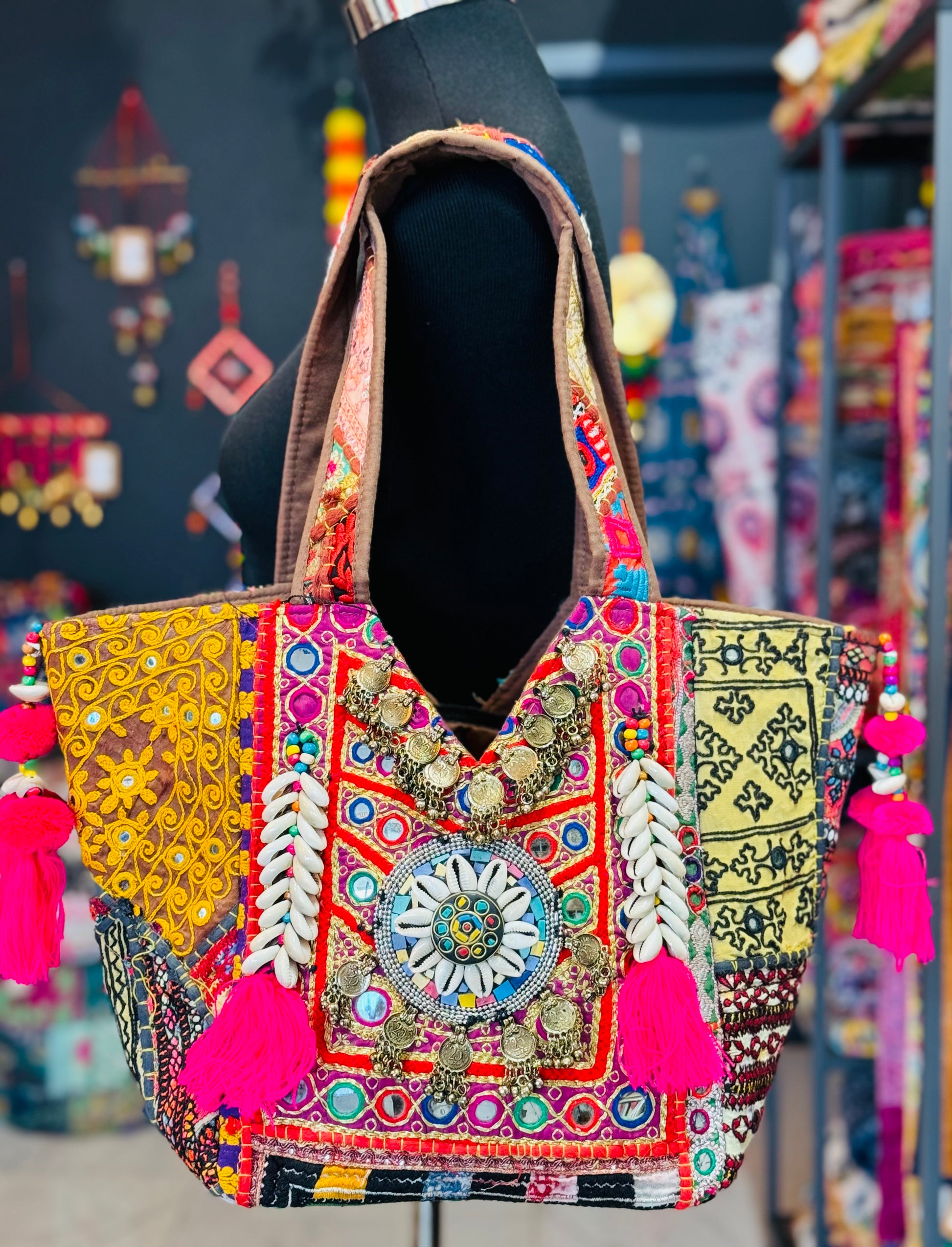 Multi color Banajra Tribal Boho Shoulder Tote Bag front decorated with a lots of mirrors in an embroidered patch with Indian coins, and shells.