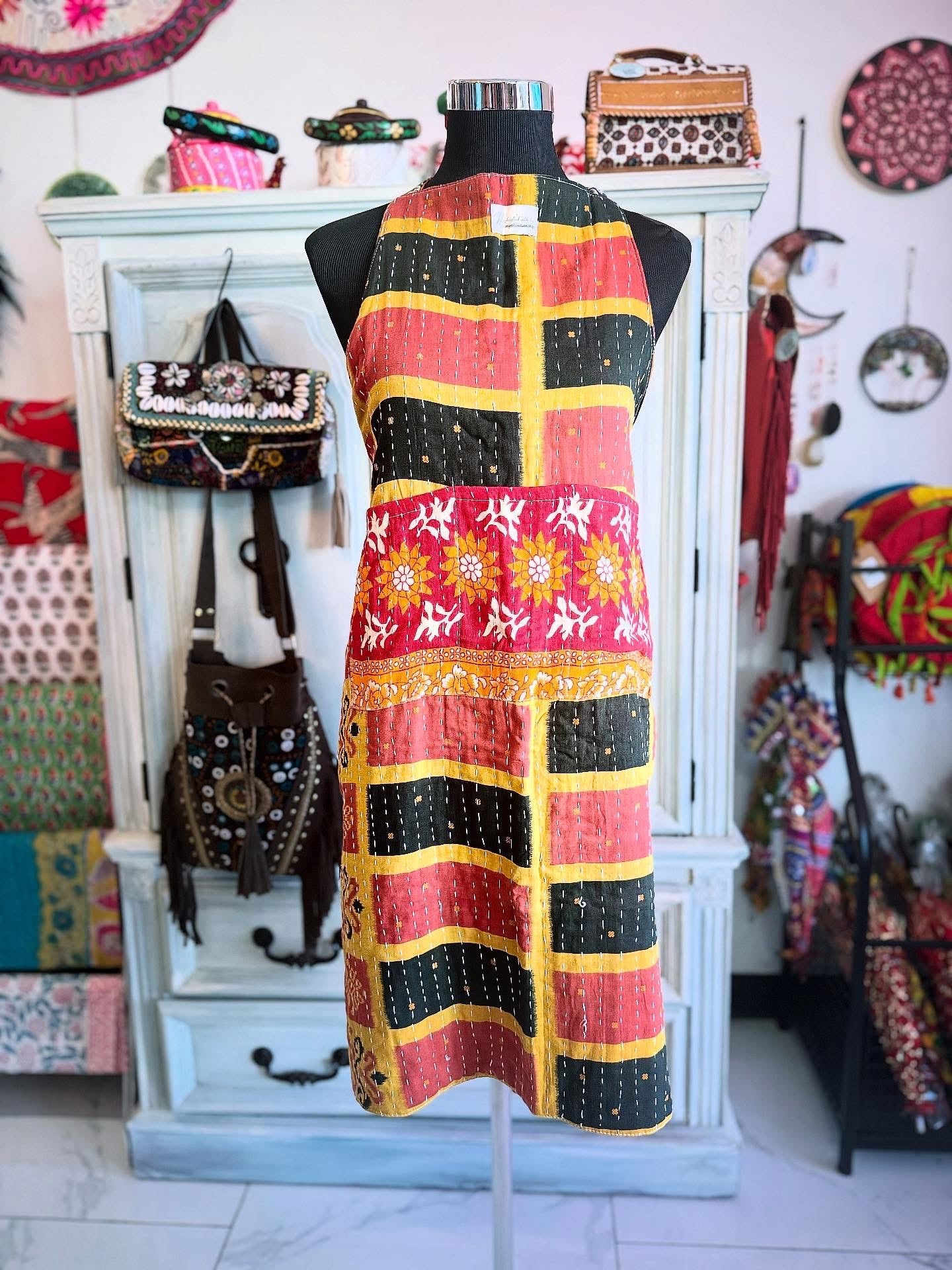 One side of Sunset Grid Kantha apron with black, red and yellow squares
