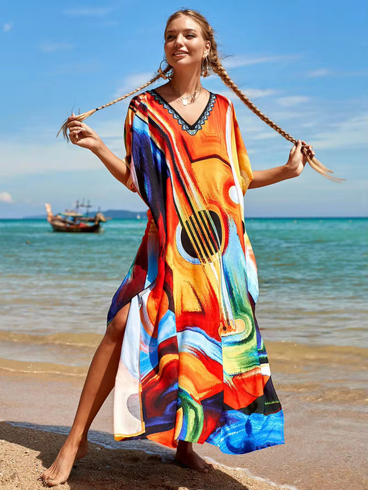 This kaftan has a guitar printed with a jewel v neck and side slits 