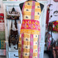 Other side of Sunset Grid kantha apron featuring floral circles and pink tones