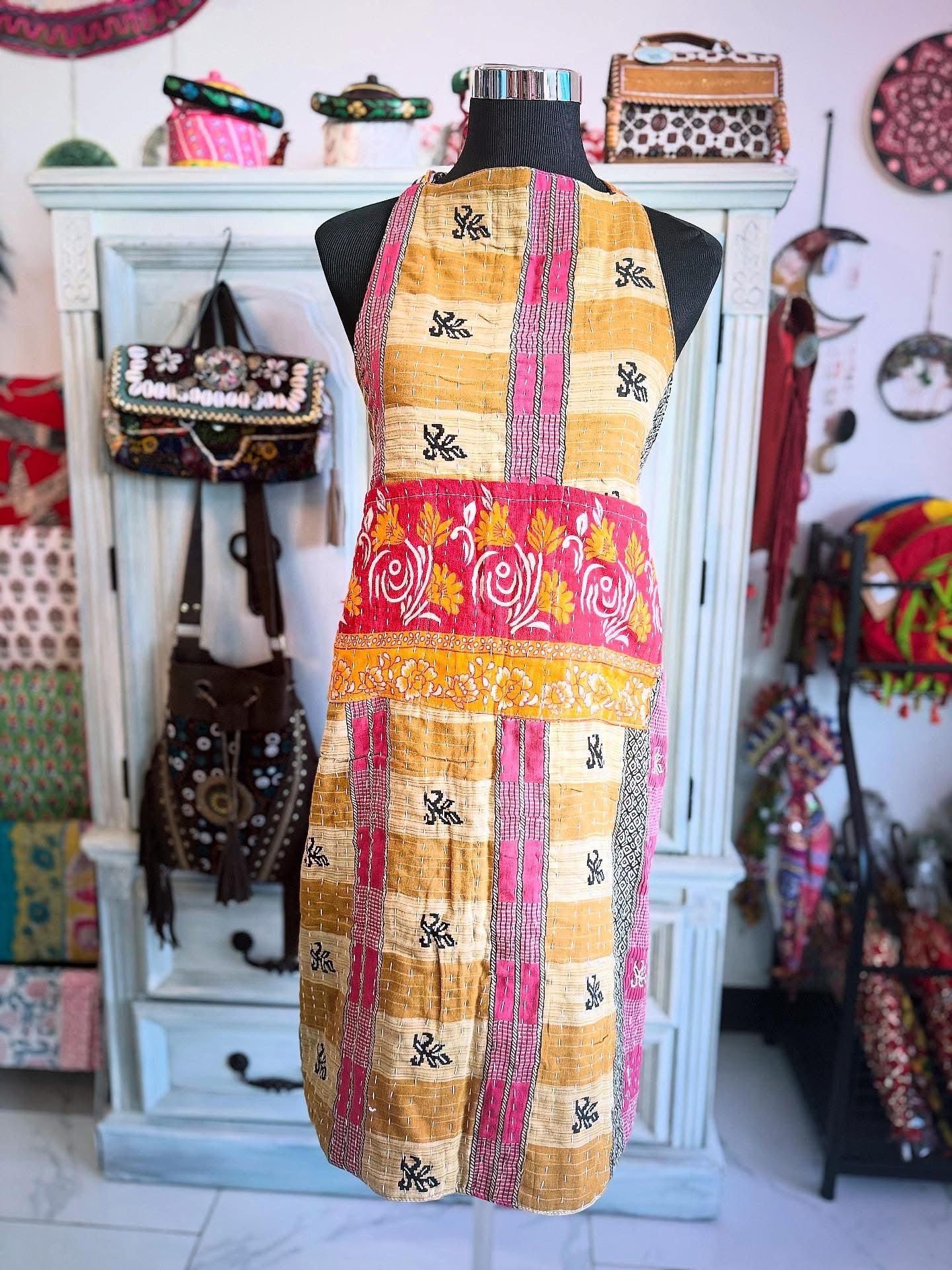 Other side of Sunset Grid kantha apron featuring floral circles and pink tones