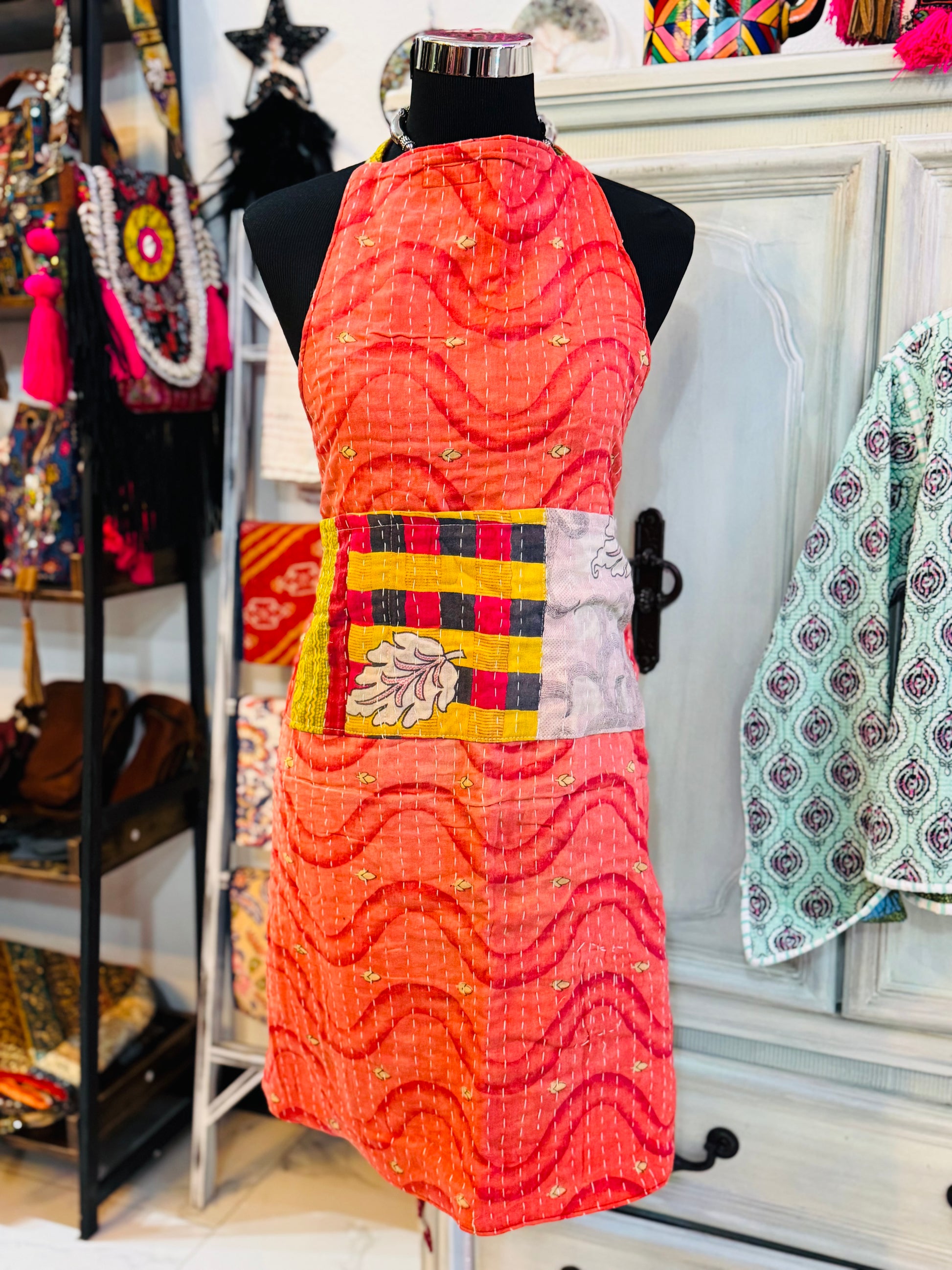 One side of white leaf kantha apron with soft white leaf on the pockets