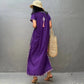 back side of the purple kaftan dress showing the tassles and lace work
