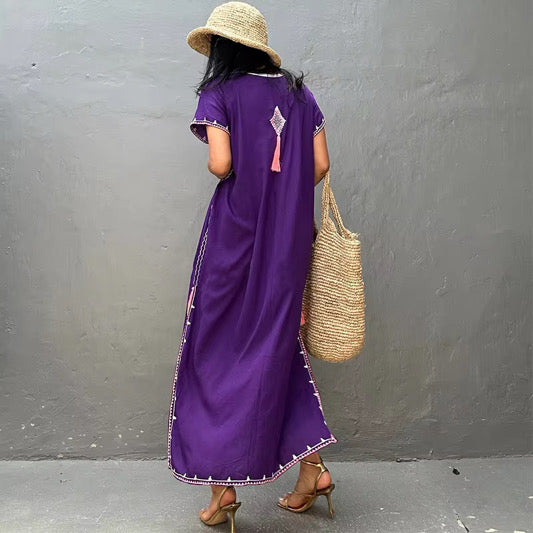 back side of the purple kaftan dress showing the tassles and lace work