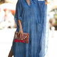 Flowy look of the buttons and pockets kaftan with blue stripes