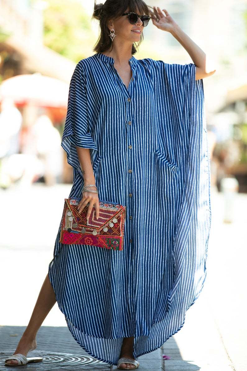 Flowy look of the buttons and pockets kaftan with blue stripes