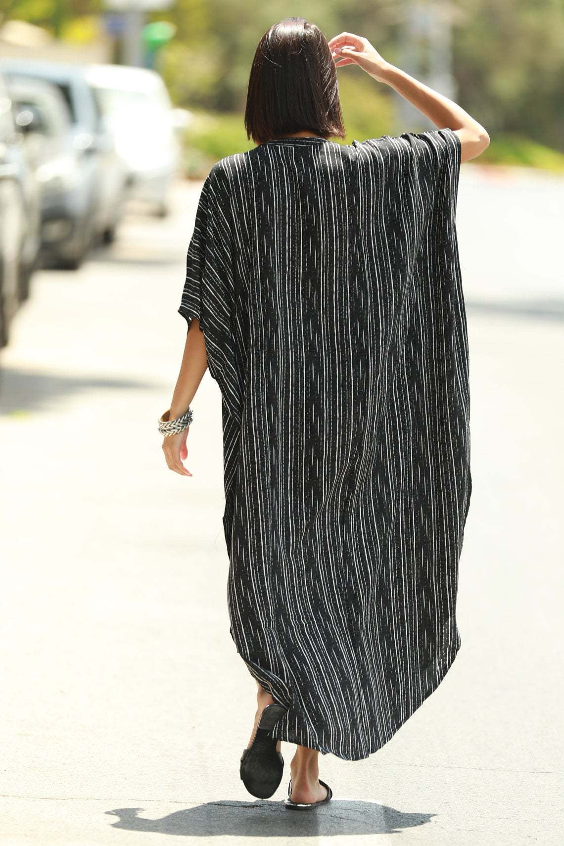 Backside of the black stripes buttons and pockets kaftan