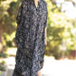 Showing off the angled look of Black and white stripes print of Buttons and pockets kaftan