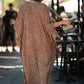 Backside of the leopard print kaftan with pockets, buttons and slits