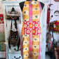 One side of Ocean Bloom apron in pink and gold patchwork with floral accents
